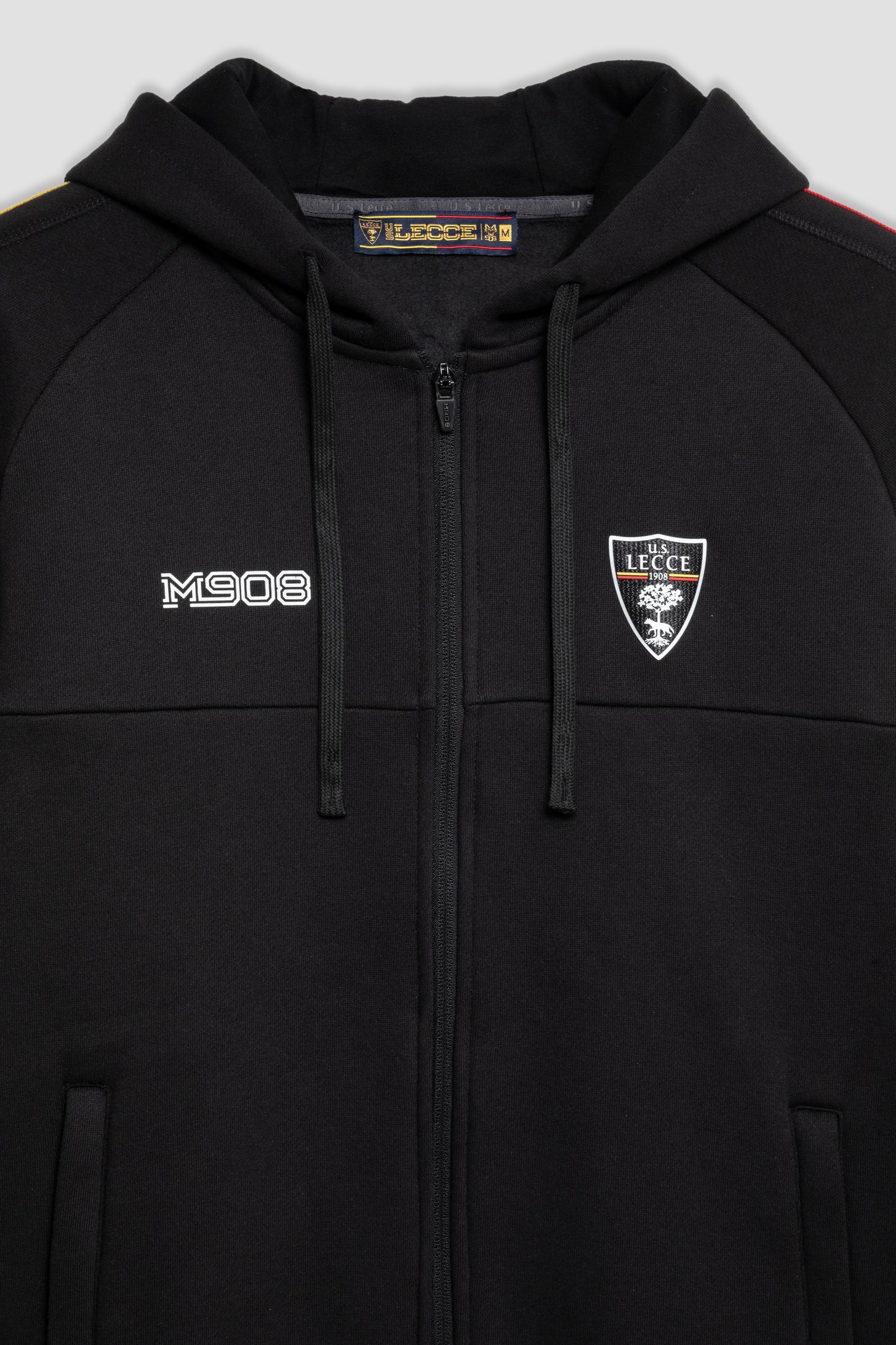 Felpa tuta nera con zip e strisce giallo-rosse