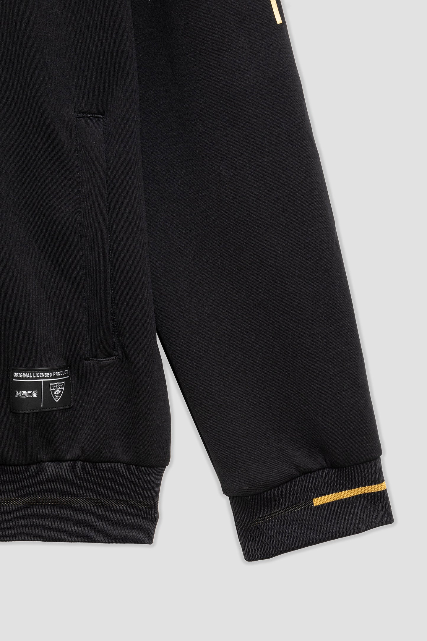 Black and gold pre-match top